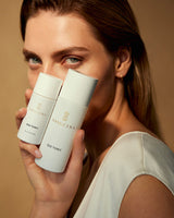 Danucera D22 Tonic bottle jar held in a model’s hand